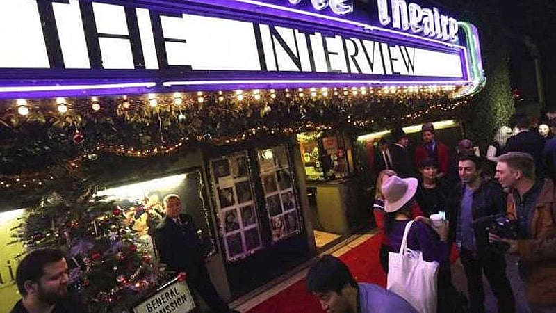Theaters bet big on massive screens, booming sound and recliners to lure movie fans
