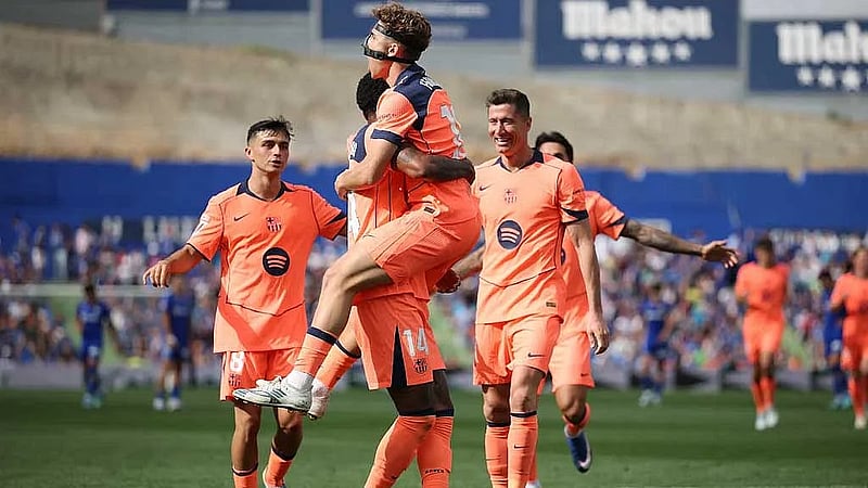 Barcelona march on towards title with 2-0 victory at Getafe