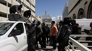 At Beirut hospital, grieving families identify mangled bodies after Israeli strikes