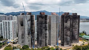 Hong Kong fire victims scour scorched homes for keepsakes