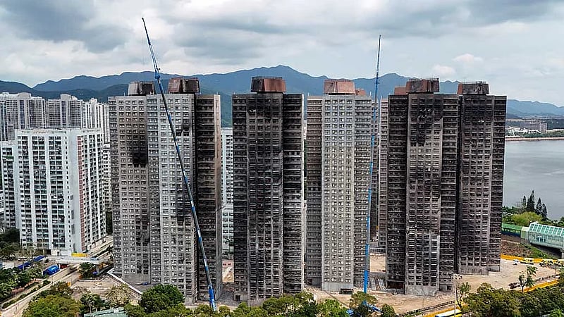 Hong Kong fire victims scour scorched homes for keepsakes