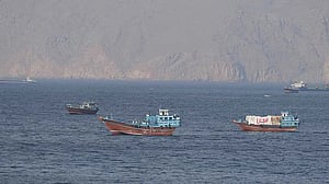 Iran shows off its control over strait, Israel warns of further attacks