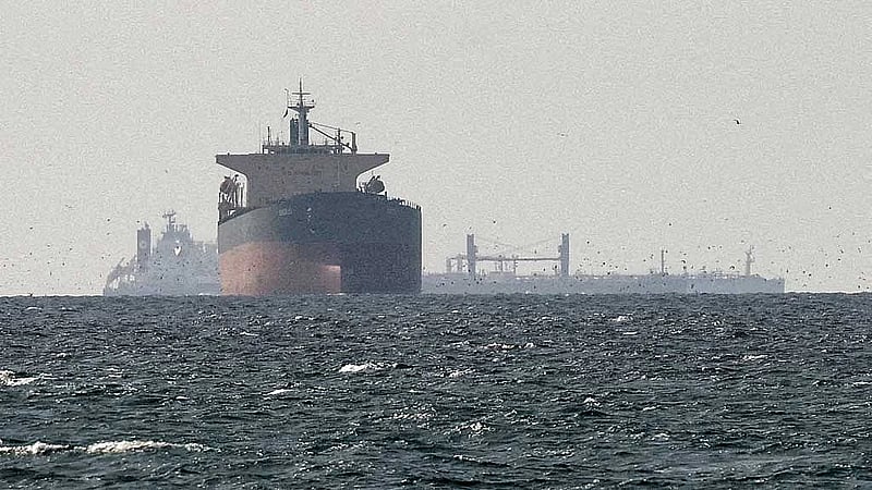 Iran Navy tells ships Strait of Hormuz shut again, two vessels report gunfire