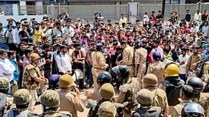 Police fire tear gas as workers' protest in India's Noida turns violent