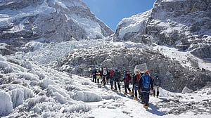 Sherpas cross icefall, open route for climbers to move up on Everest
