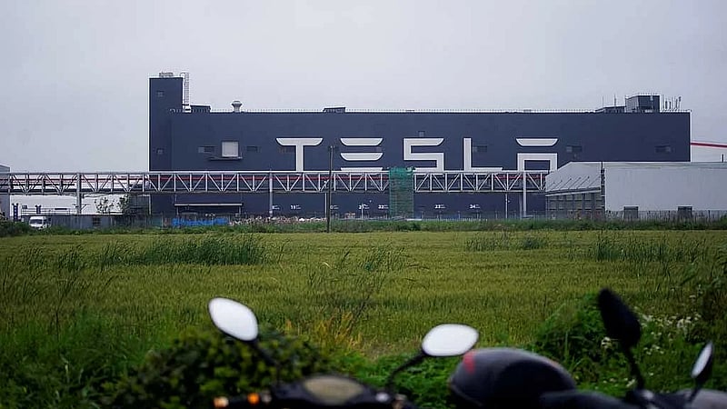 Tesla is developing a new smaller, cheaper EV, sources say