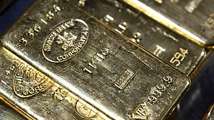 Gold gains over 1 percent on soft US data, Trump's fresh tariff move
