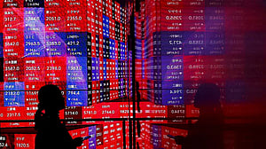 Wall St futures, dollar drop amid US tariff tumult