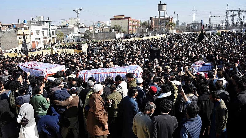 Thousands mourn victims of suicide bombing in Islamabad, as four arrests made