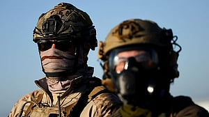 US judge rejects California law that banned masks for federal officers