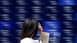Stocks slide in Asia as metals melt down, earnings loom