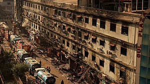 Rescue workers clearing Karachi inferno ruins, 57 missing feared dead