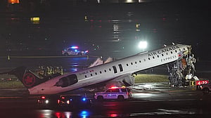 Passenger jet collides with fire truck in New York's LaGuardia, killing both pilots