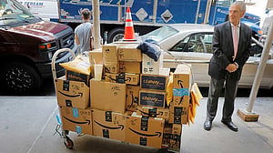 Amazon plans sharp cut in packages it sends through US Post Office, source says