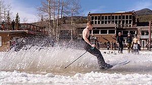 In record heat, US ski resorts bulldoze snow, skiers wear bikinis