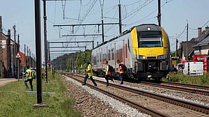 Train collides with school van in Belgium, killing four