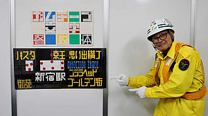 Japanese security guard finds fame as designer of duct tape signs