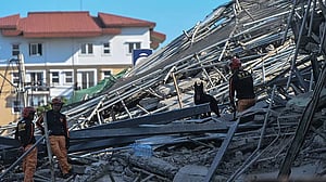 At least one dead in Philippine building collapse, 21 people missing