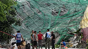 Philippine rescuers racing against time a day after deadly building collapse