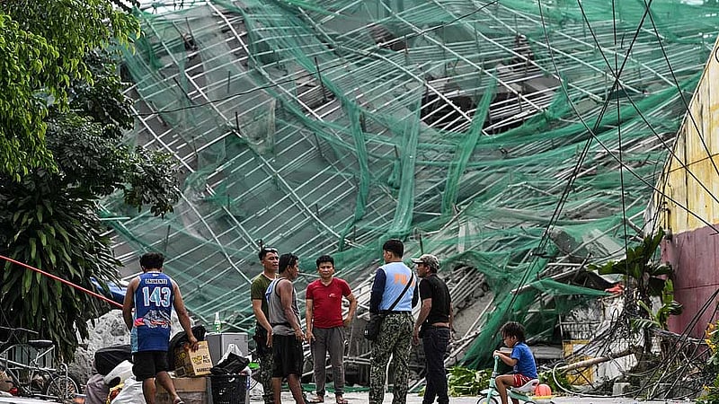 Philippine rescuers racing against time a day after deadly building collapse