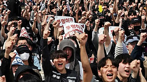 Samsung workers approve pay deal, shares surge