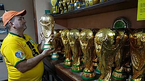 In Rio, artisan crafts World Cup trophies while hoping Brazil gets a real one