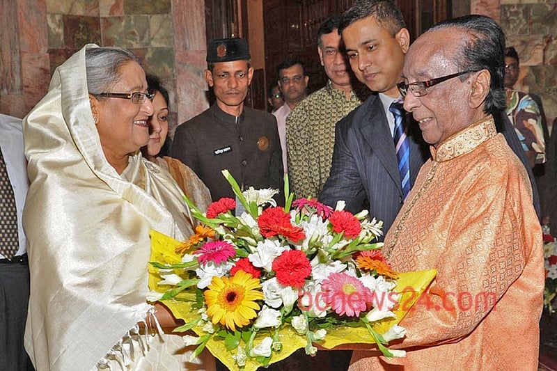 Zillur Rahman accepting floral greetings from Prime Minsiter Sheikh Hasina at the Bangabhaban.