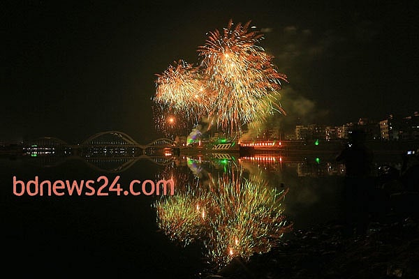 Fireworks light up the night sky during a festival of lights at Hatirjheel in Dhaka to celebrate attainement of 10,000 megawatt power generation capacity.