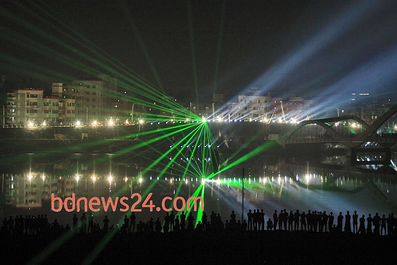 Laser show on the night sky of Hatirjheel in Dhaka during a festival of lights to celebrate reaching 10,000 megawatt power generation capacity. Photo: asaduzzaman pramanik