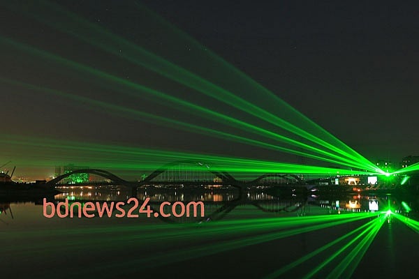 Laser show on the night sky of Hatirjheel in Dhaka during a festival of lights to celebrate reaching 10,000 megawatt power generation capacity.