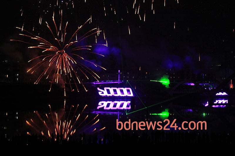 Spectacular fireworks accompanied by laser show light up the night sky over the Hatirjheel in Dhaka during a festival of lights to celebrate reaching 10,000 megawatt power generation capacity. Photo: asaduzzaman pramanik