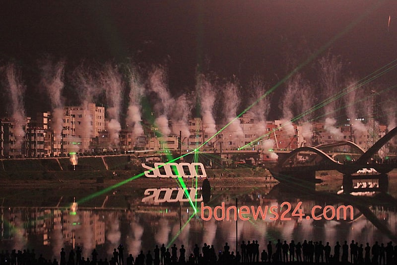 Spectacular fireworks accompanied by laser show light up the night sky over the Hatirjheel in Dhaka during a festival of lights to celebrate reaching 10,000 megawatt power generation capacity. Photo: asaduzzaman pramanik