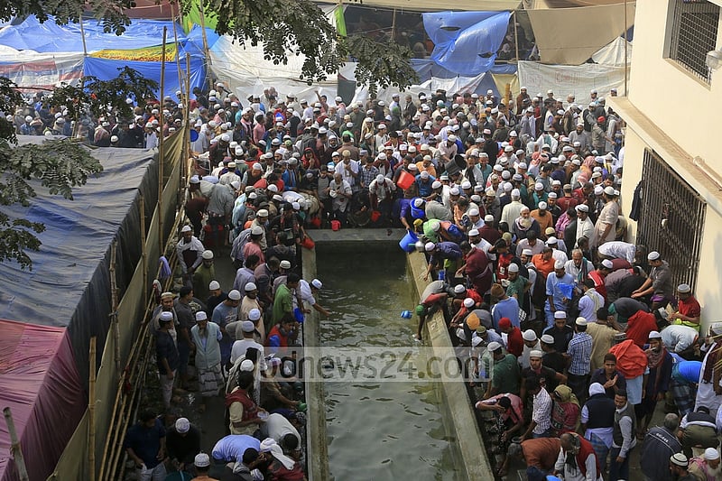 Devotees wash themselves before offering Jumma prayers on the first day of Bishwa Ijtema on Friday.