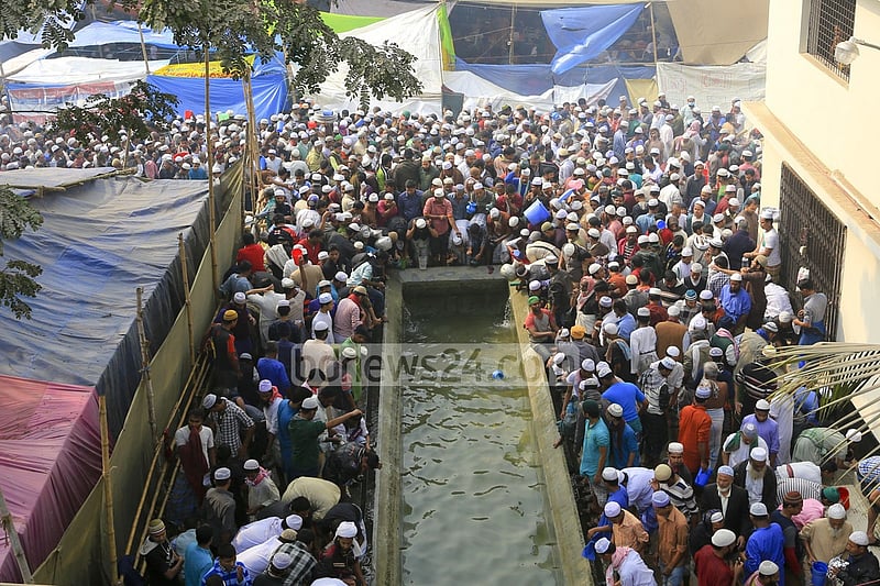 Devotees wash themselves before offering Jumma prayers on the first day of Bishwa Ijtema on Friday.