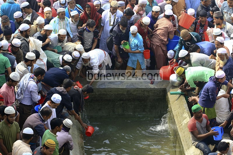Devotees wash themselves before offering Jumma prayers on the first day of Bishwa Ijtema on Friday.