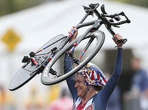 American Armstrong wins third straight time trial gold