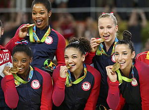 US women blow away opposition to win gold in gymnastics