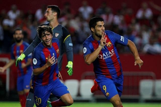 Suarez, Munir strikes edge Barca towards Super Cup