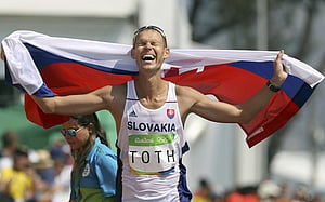 Toth overhauls Tallent to win 50km walk gold