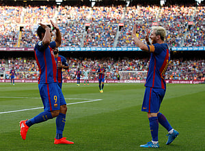 Suarez treble and Messi double lift six-goal Barca