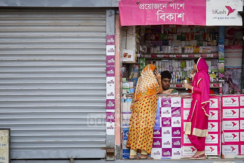 Garment factory workers send money home.
