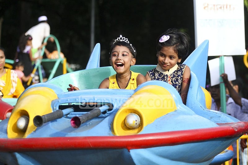 Children enjoy a ride at Shishu Park on Tuesday after the Eid. Photo: abdul mannan