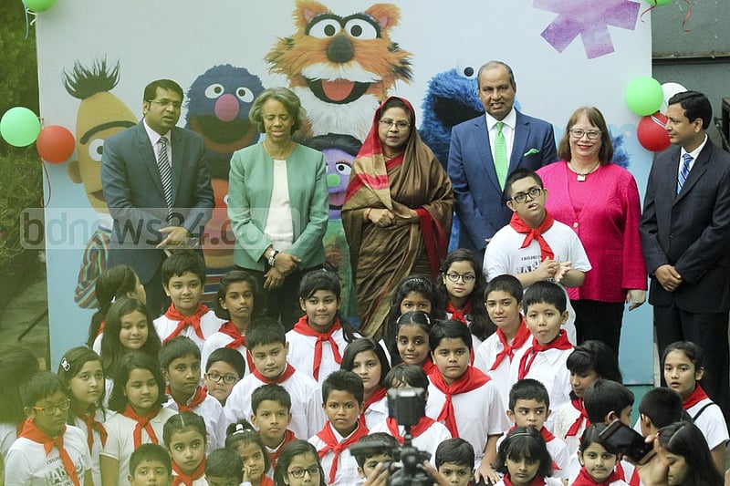 Invited guests pose for a group photo along with the children at the inauguration ceremony of a new Sisimpur project at Bengal Multimedia Studio at Tejgaon. Photo: abdul mannan