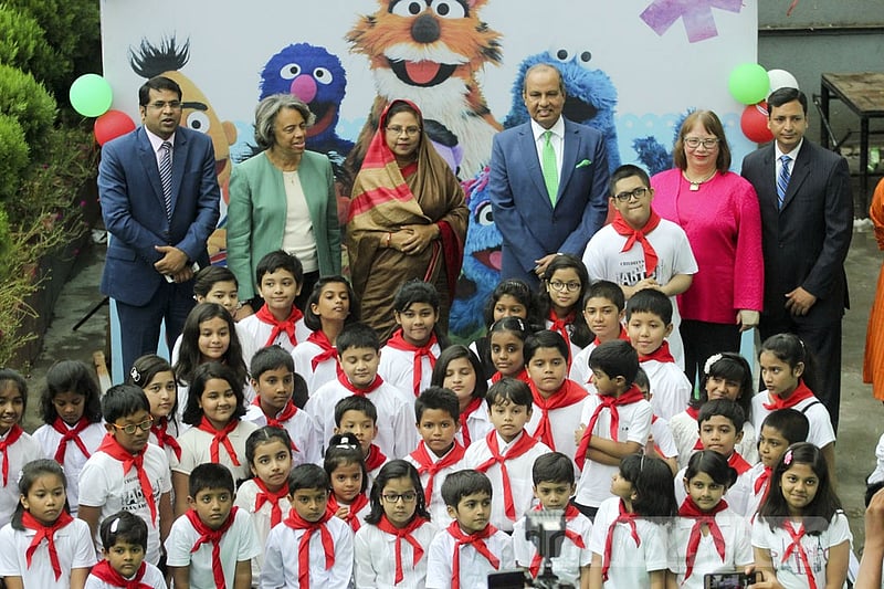 Invited guests pose for a group photo along with the children at the inauguration ceremony of a new Sisimpur project at Bengal Multimedia Studio at Tejgaon. Photo: abdul mannan
