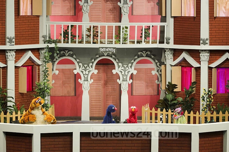 Puppetshow Sisimpur's 'Halum' and 'Tuktuki' with two other characters at the inauguration ceremony of a new project of the popular show on Wednesday. Photo: abdul mannan