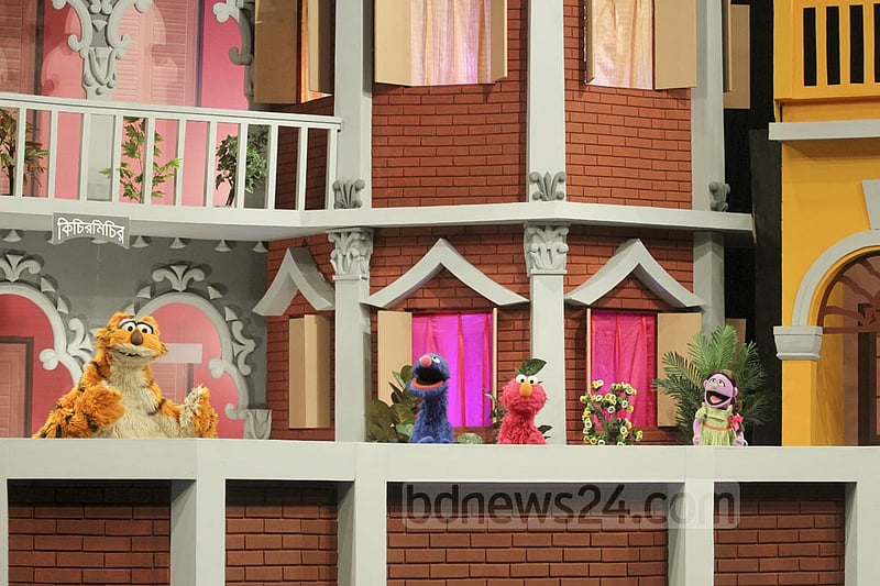 Puppetshow Sisimpur's 'Halum' and 'Tuktuki' with two other characters at the inauguration ceremony of a new project of the popular show on Wednesday. Photo: abdul mannan