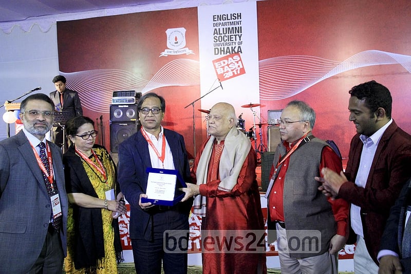 Finance Minister AMA Muhith hands over a crest to DU English Prof Fakrul Alam during the EDAS annual bash on Saturday at the TSC.