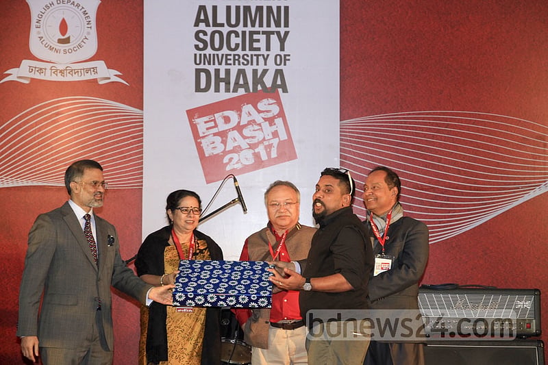 The winner of the raffle draw receives a laptop sponsored by telecom firm ADN Group at the EDAS annual bash on Saturday.