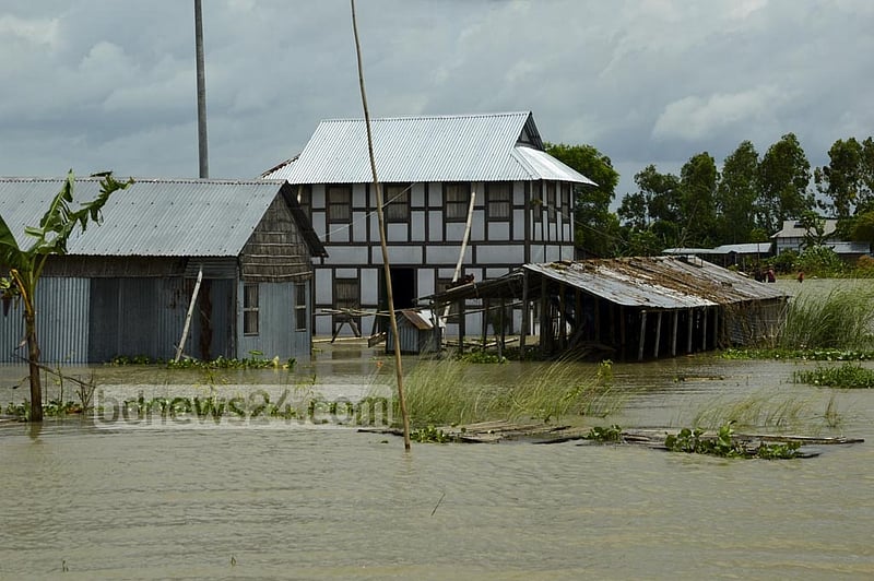 Floods submerged many houses on the Brahmangaon Char, a small island in Munshiganj’s Louhajang Upazila, leaving many residents marooned.