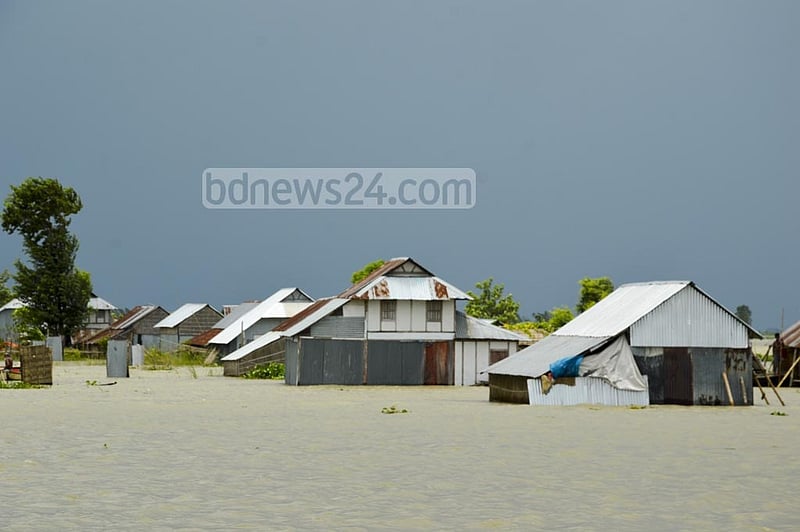 Floods submerged many houses on the Brahmangaon Char, a small island in Munshiganj’s Louhajang Upazila, leaving many residents marooned.